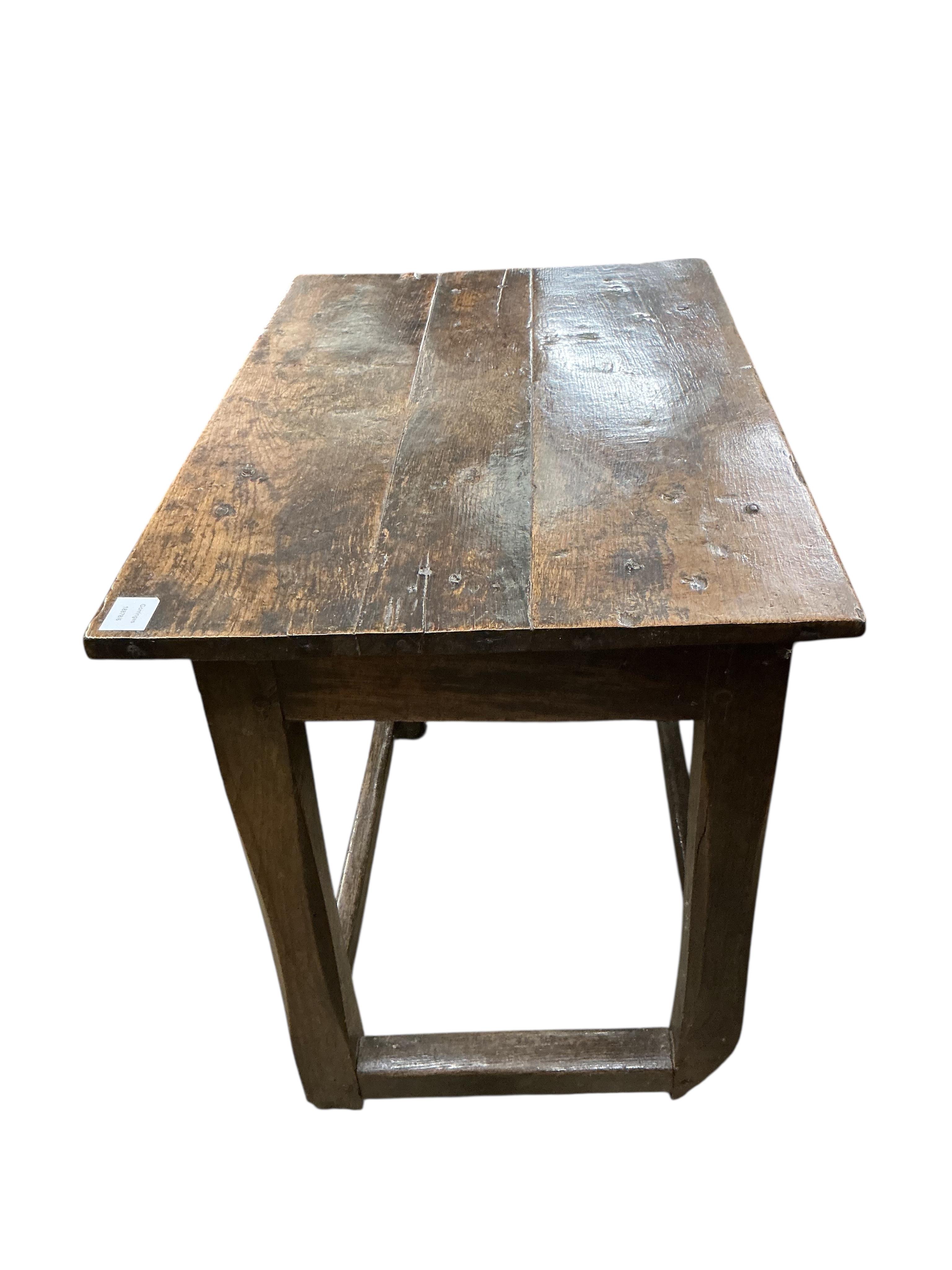 A small late 17th century oak side table, the rectangular top on square chamfered supports, width 80cm, depth 53cm, height 71cm